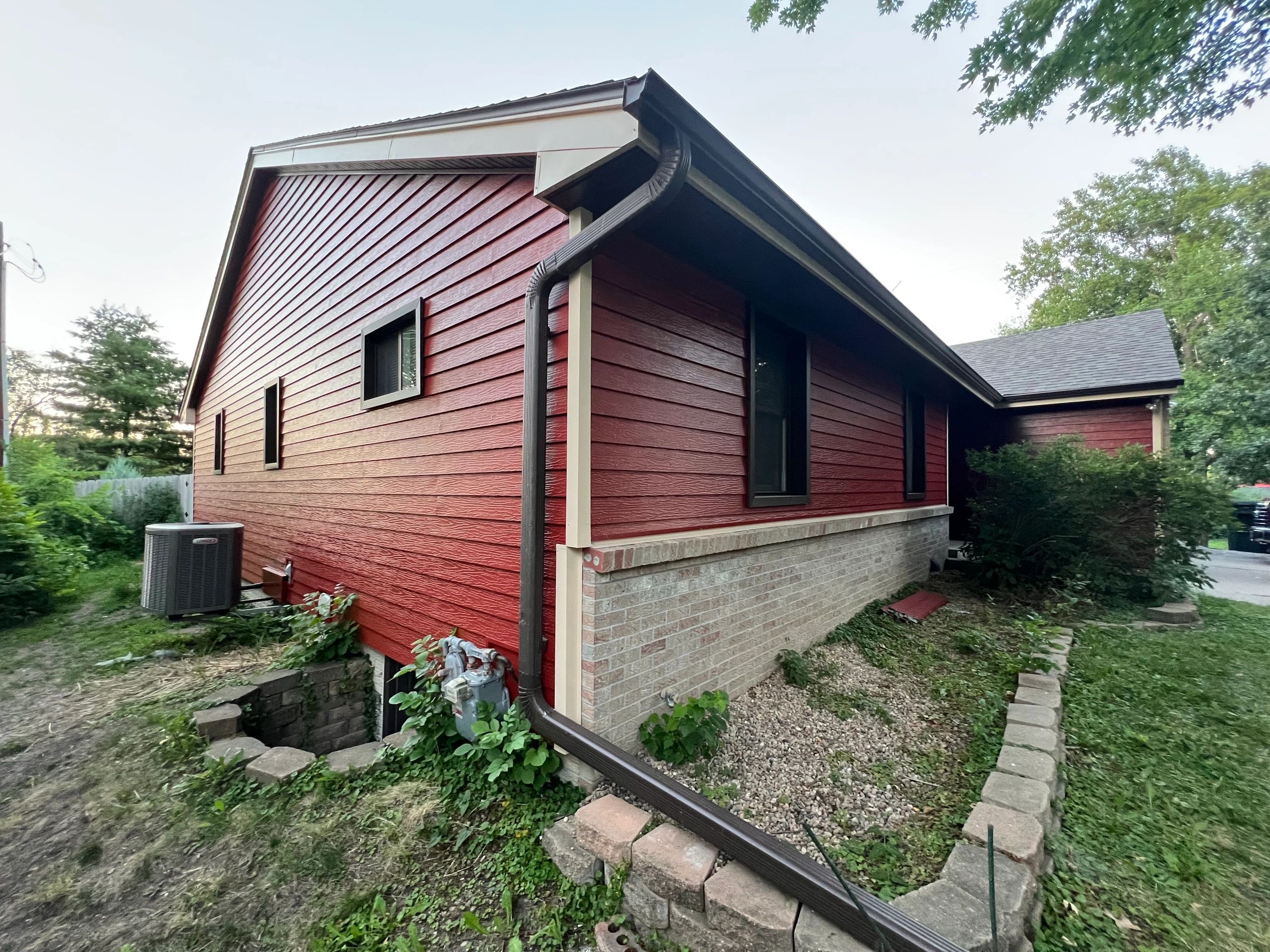 Red sided house with contrasting trim